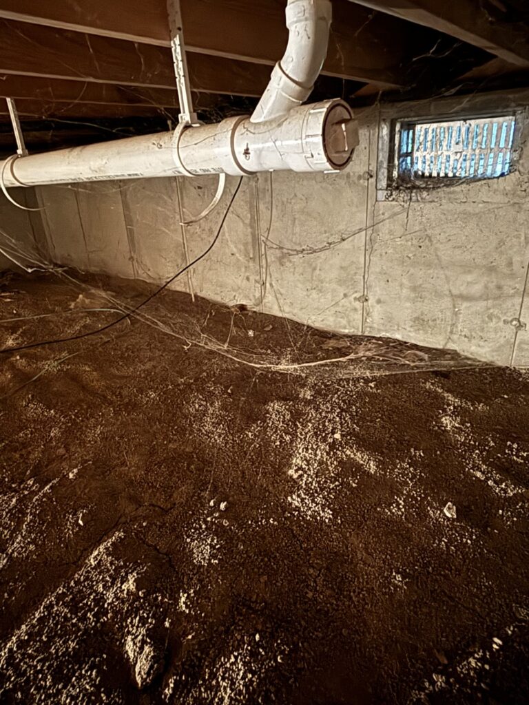 Old, musty crawl space in a St. Louis, MO home with visible signs of moisture and neglect.