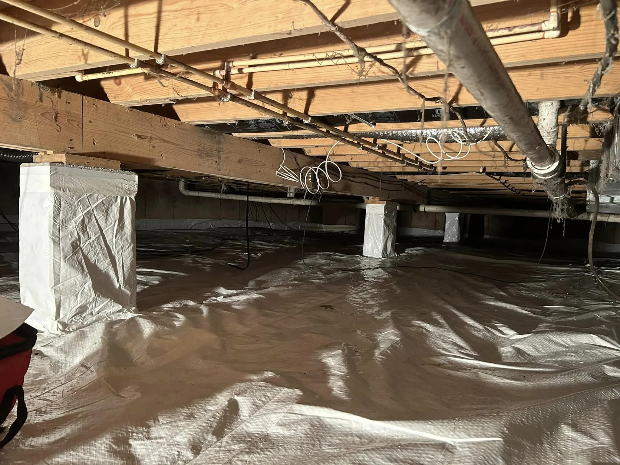 Crawl space vapor barrier installation in a St. Louis area home