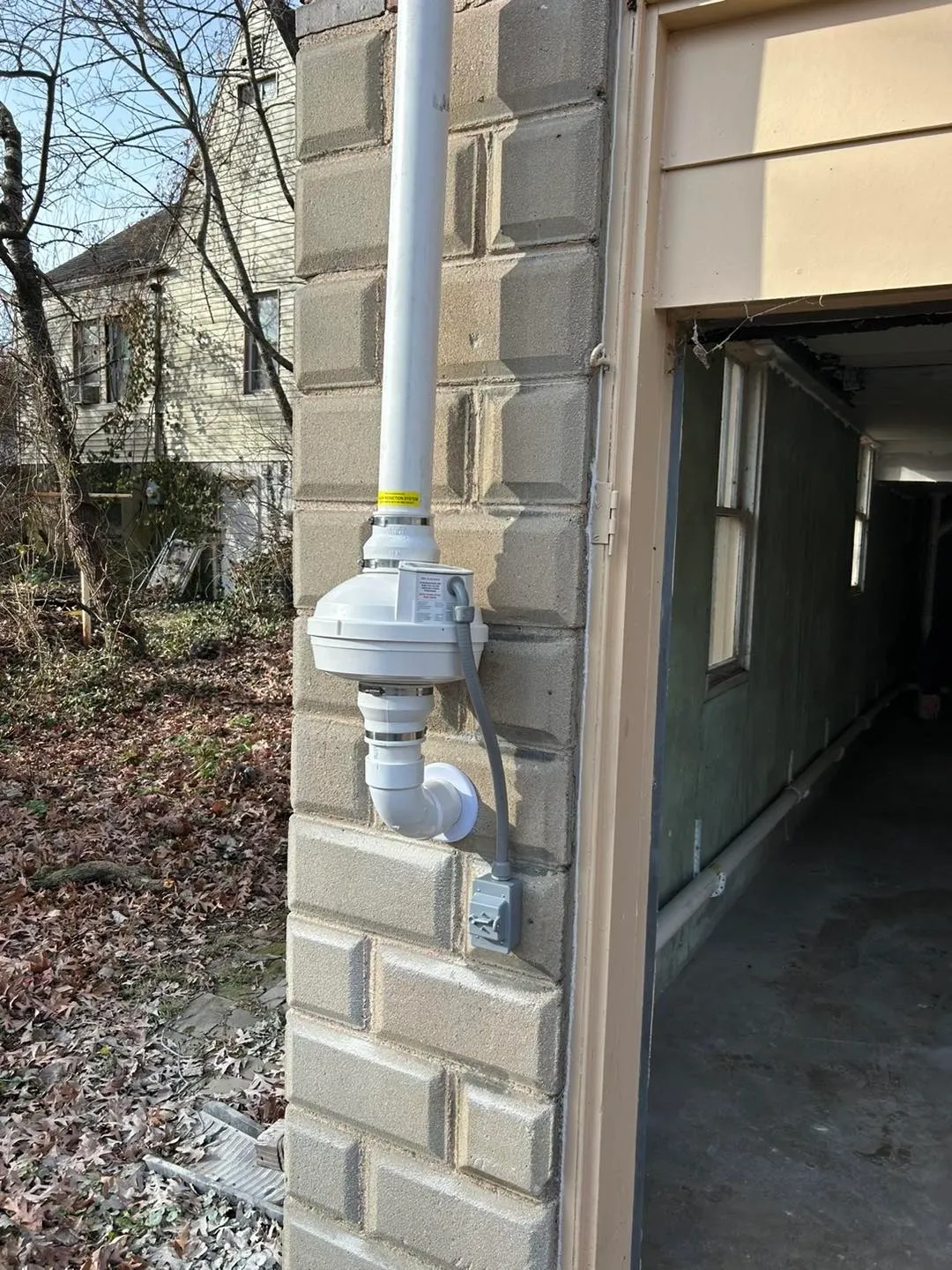 Radon reduction system and testing monitor